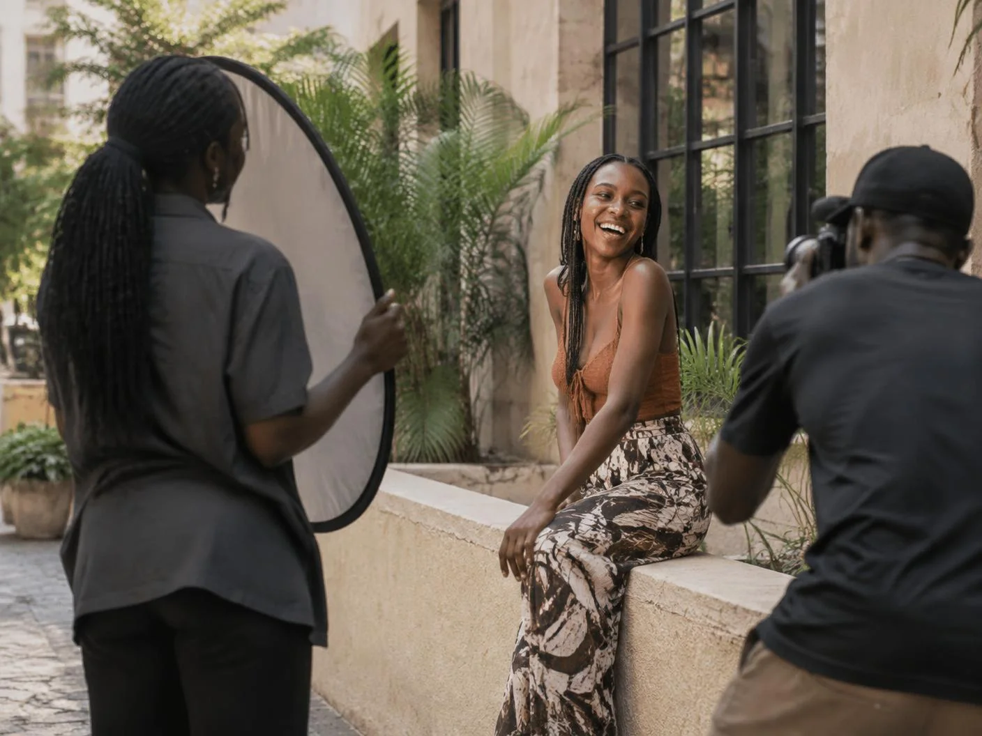Creative crew photographing a lifestyle brand campaign in a sunlit courtyard